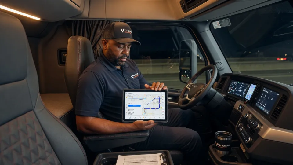 Driver reviewing routes in cab